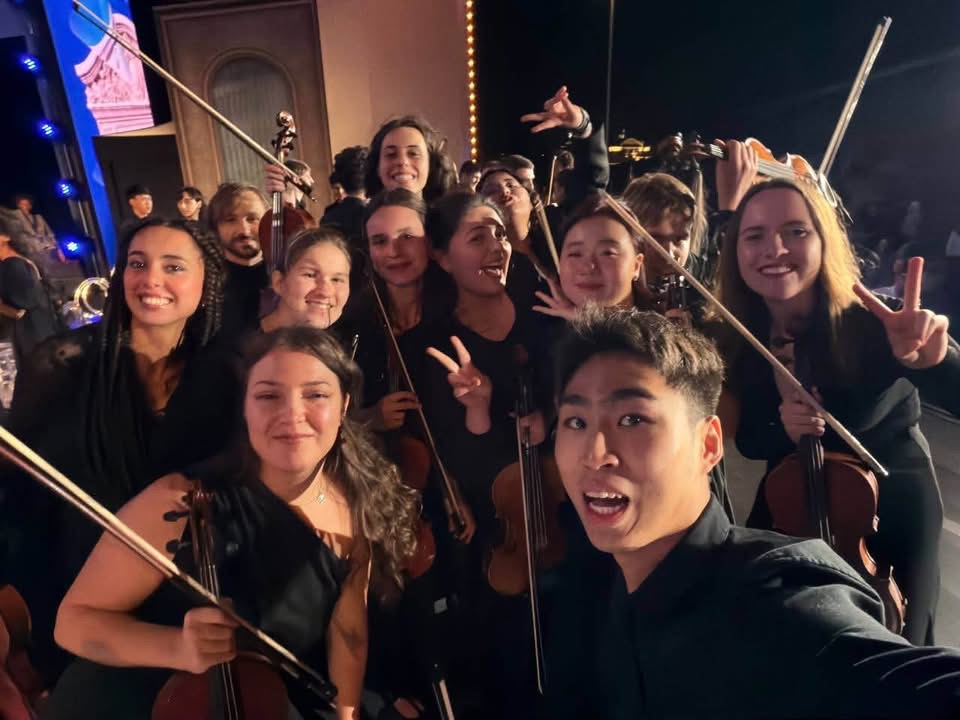 Ruby Ngọc Minh with the orchestra backstage