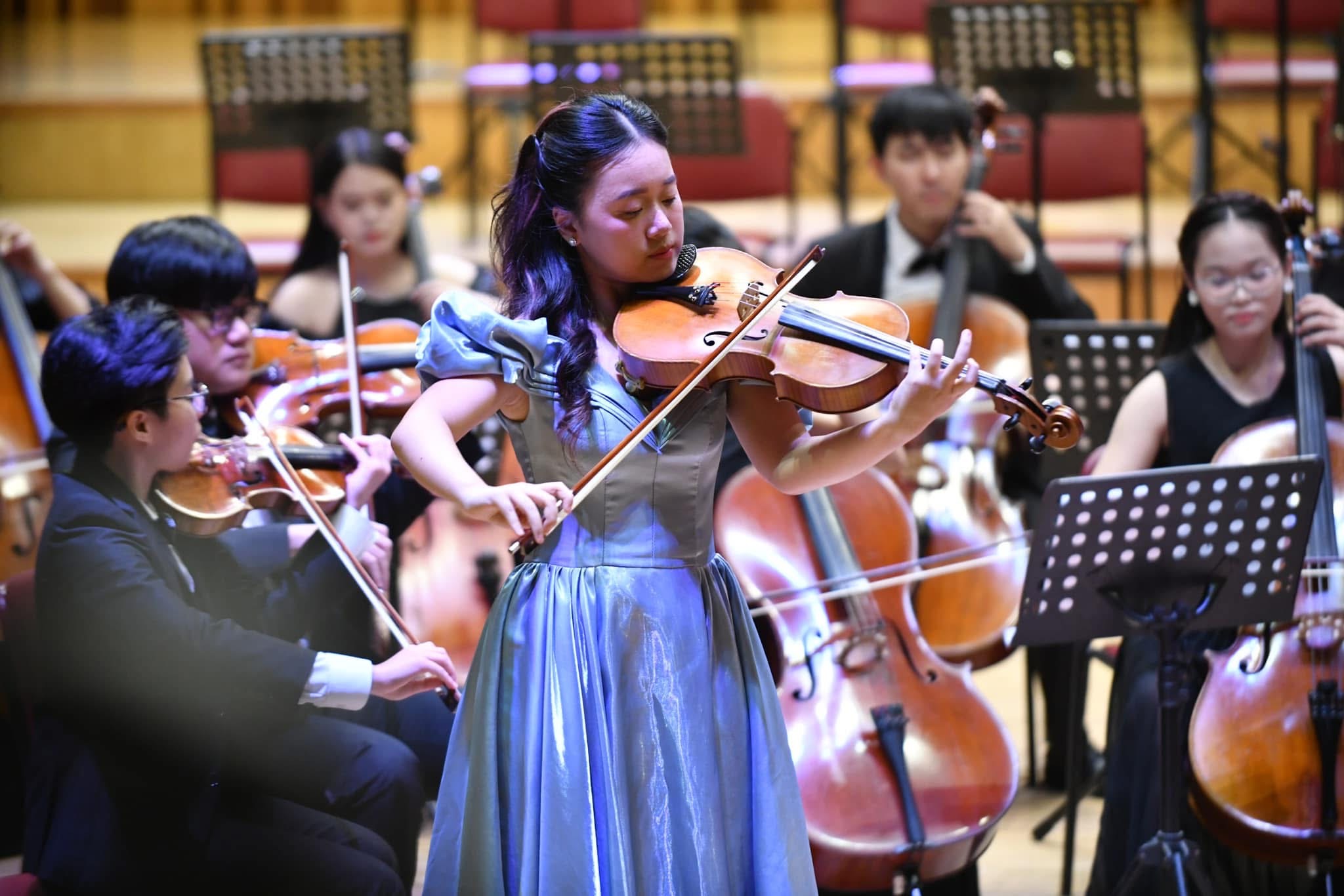 Ruby Ngọc Minh performing as viola soloist with orchestra