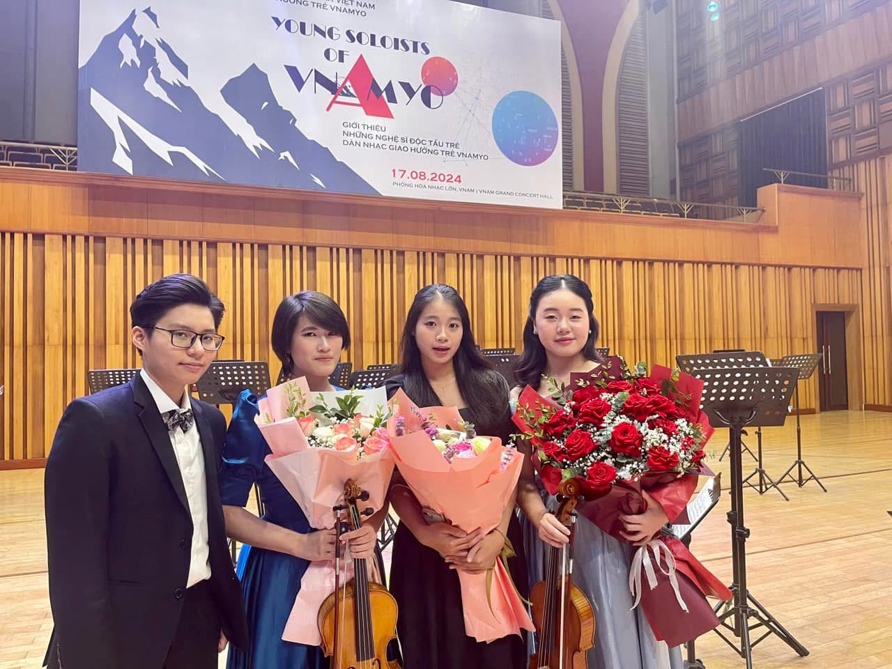 Ruby Ngọc Minh with fellow young musicians
