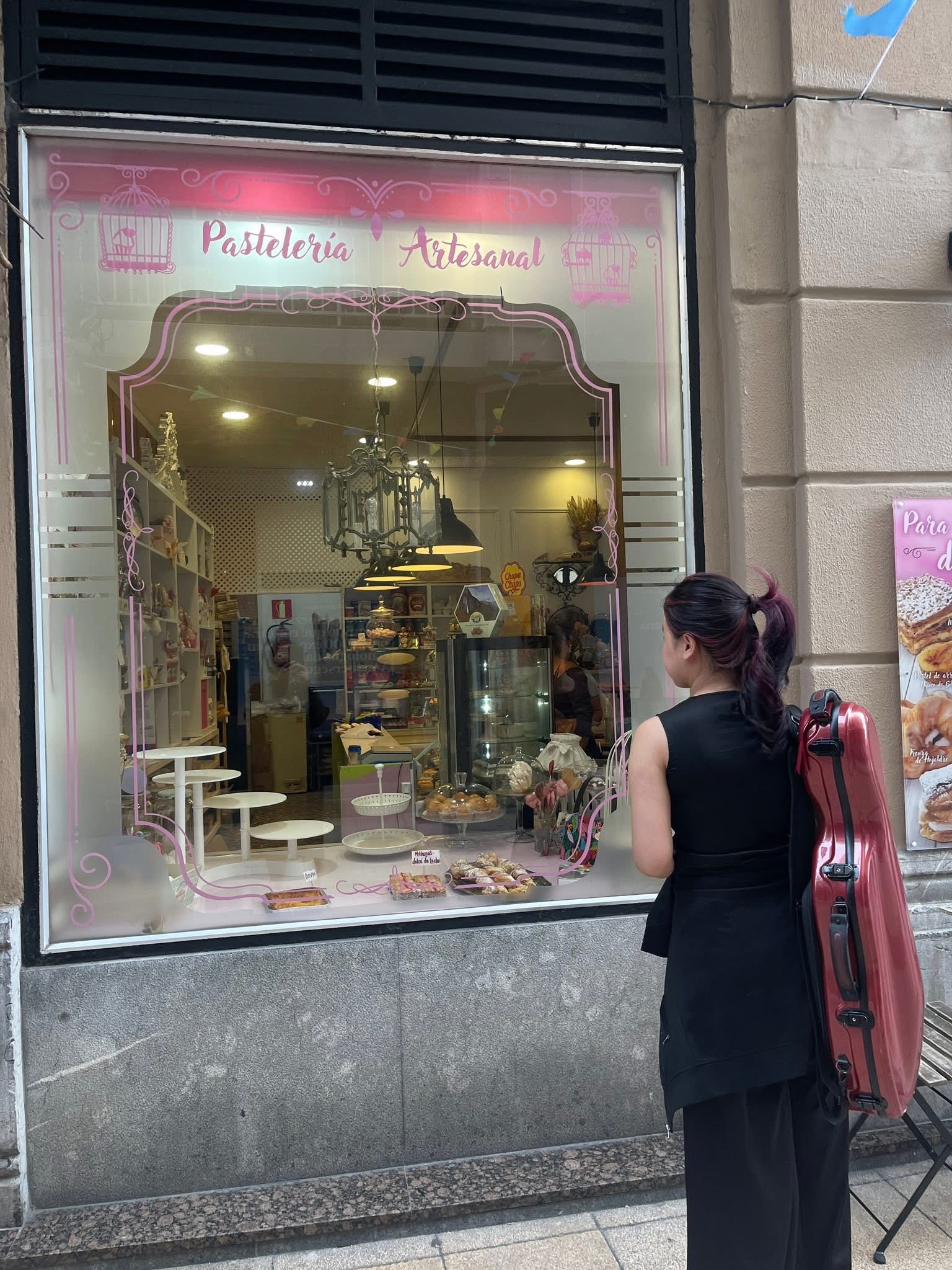 Ruby Ngọc Minh outside a pastry shop in Salamanca